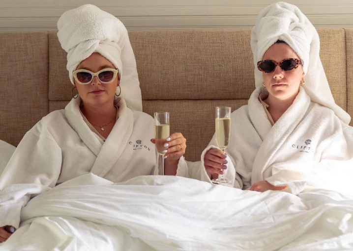 women chilling out in a hotel - arise hotel marketing